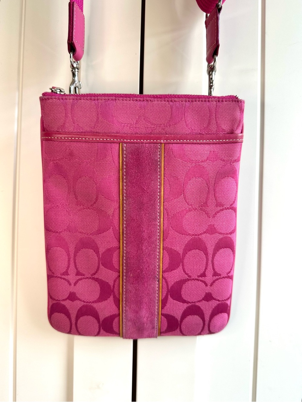 Coach signature north south crossbody in pink with suede trim